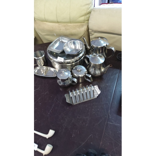 180 - Extensive lot of vintage stainless steel tableware, including teapots, serving trays, creamers, and ... 