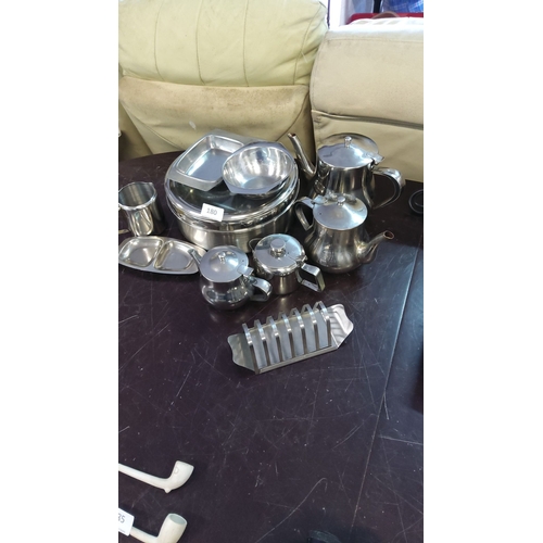 180 - Extensive lot of vintage stainless steel tableware, including teapots, serving trays, creamers, and ... 