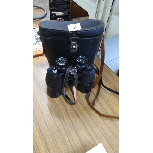 33 - Vintage Ross London 12 x 40 binoculars with original leather case and leather strap.(pwo)