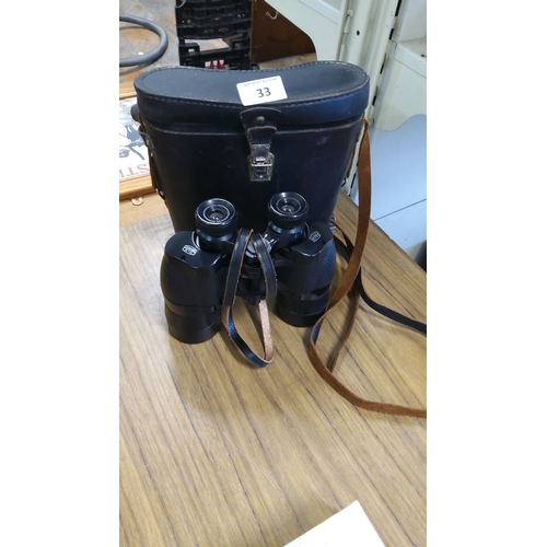 33 - Vintage Ross London 12 x 40 binoculars with original leather case and leather strap.(pwo)