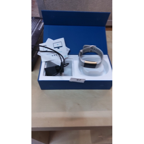 47 - Fitbit Charge 2 fitness tracker in original box with charger and manuals. Features heart rate monito... 