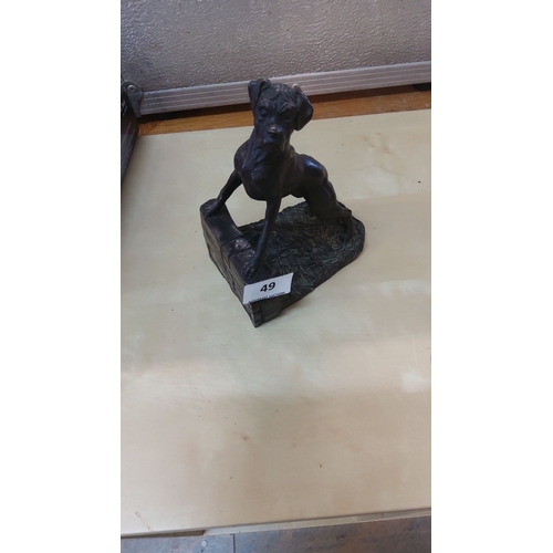 49 - Heredities dog figurine on a textured base, finely detailed with a lifelike stance.