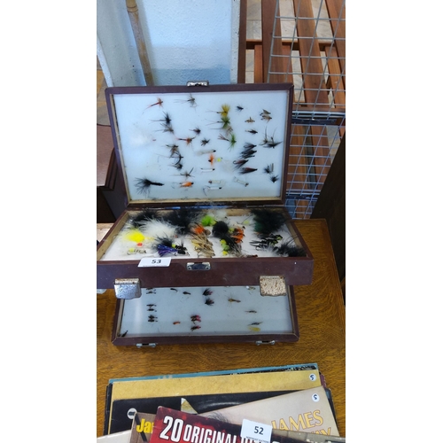 53 - Vintage wooden fly fishing tackle box with an assortment of hand-tied fishing flies in various sizes... 