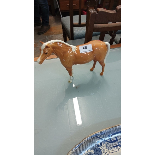 60 - Beswick porcelain horse figurine, gloss finish, chestnut and white coloring. Marked 