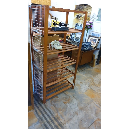 67 - Wooden multi-tier storage rack with wire side panel. Sturdy construction with ample shelving.