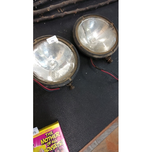 75 - Pair of vintage Raydyot halogen vintage spotlights, featuring glass lenses and metal casings.