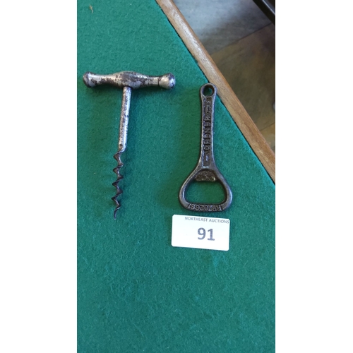 91 - Vintage metal corkscrew with T-handle and cast iron bottle opener, marked with patent number.