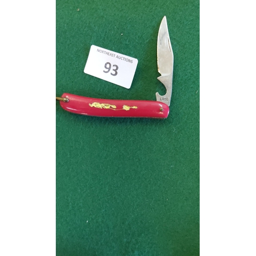 93 - Vintage Lark folding pocket knife with red handle and gold-tone design. The knife includes a stainle... 