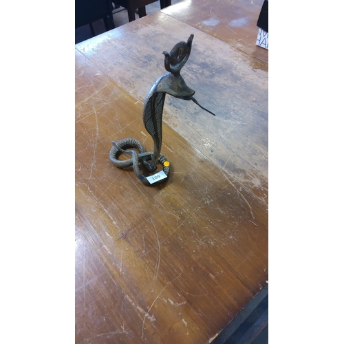 109 - Cast brass sculpture of a rearing cobra with coiled base, the hood supporting a shallow dish and a p... 