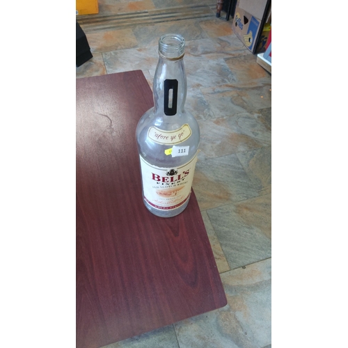 111 - Empty clear glass Bell's Finest Old Scotch Whisky 4.5 litre bottle with coin slot on neck