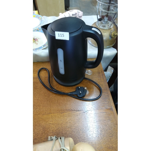 115 - Black plastic electric jug kettle with detachable base, 1.5 L water level indicator and UK three-pin... 