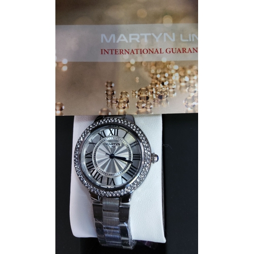 120 - Stainless steel quartz wristwatch by Martyn Line, Roman numeral silver dial, crystal-set bezel, link... 