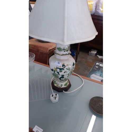 61 - Porcelain baluster-form Masons chartreuse table lamp, white grabric shade, circa mid-20th century.