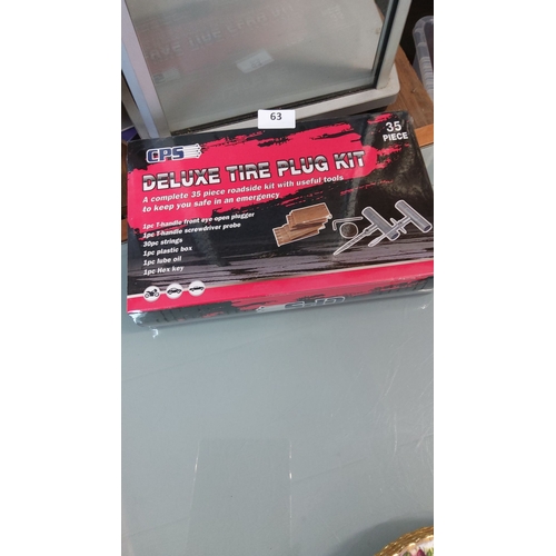 63 - CPS Deluxe 35-piece tire plug roadside repair kit in original retail box.