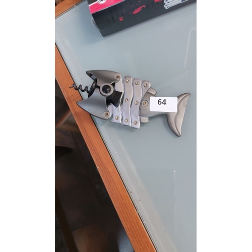 64 - Brushed metal novelty corkscrew and bottle opener styled as a skeletal fish, with hinged body plates... 
