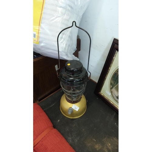77 - Vintage industrial metal and glass lantern with protective wire cage, iron carrying handle and bell-... 