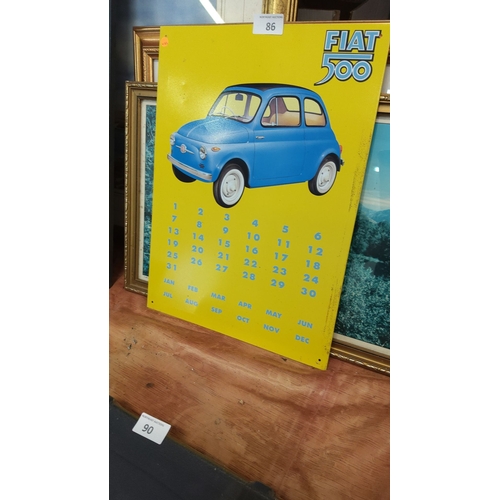 86 - Yellow tin advertising sign for the Fiat 500, featuring blue car illustration and perpetual calendar... 