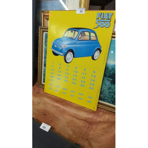 86 - Yellow tin advertising sign for the Fiat 500, featuring blue car illustration and perpetual calendar... 