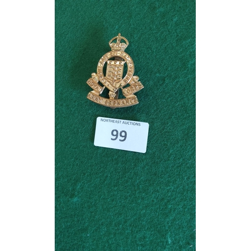 99 - Gilt brass cap badge of the British Royal Army Ordnance Corps, crowned Garter bearing motto with cen... 