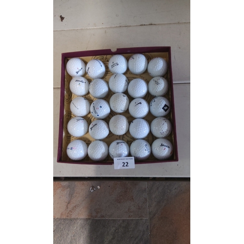 22 - Box containing 25 mixed-brand white golf balls, including examples by Titleist, Srixon, Nike and oth... 