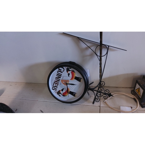 23 - Guinness advertising double-sided circular wall clock with toucan motif