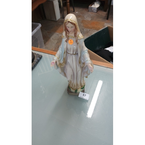 57 - Glazed plaster figure of the Virgin Mary with gilt-trimmed robes, standing on a rectangular plinth, ... 