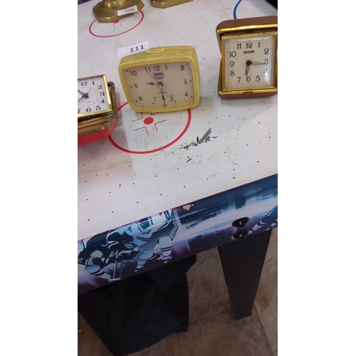 111 - Group of three vintage travel alarm clocks: gilt-framed Equity quartz example, yellow plastic-cased ... 