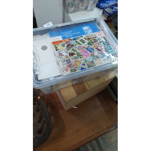 119 - Plastic storage tub containing an accumulation of worldwide loose postage stamps and covers, includi... 