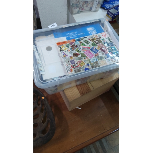 119 - Plastic storage tub containing an accumulation of worldwide loose postage stamps and covers, includi... 