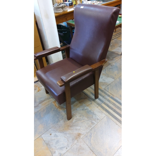 68 - Brown leatherette upholstered high-back armchair with angular hardwood frame and padded armrests, re... 