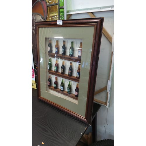 70 - Shadow-boxed display of 15 miniature glass beer bottles with assorted brewery labels, mounted on thr... 