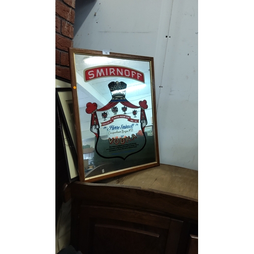 78 - Framed reverse-printed advertising mirror for Smirnoff Vodka, featuring crest, Cyrillic script and b... 