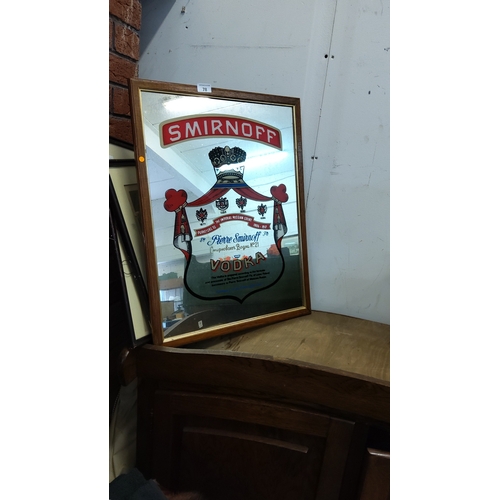 78 - Framed reverse-printed advertising mirror for Smirnoff Vodka, featuring crest, Cyrillic script and b... 