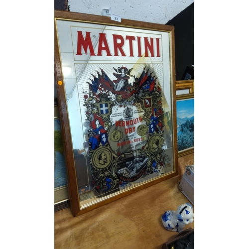 83 - Framed glass advertising mirror for Martini & Rossi ‘Vermouth Dry’, reverse-printed with heraldic mo... 