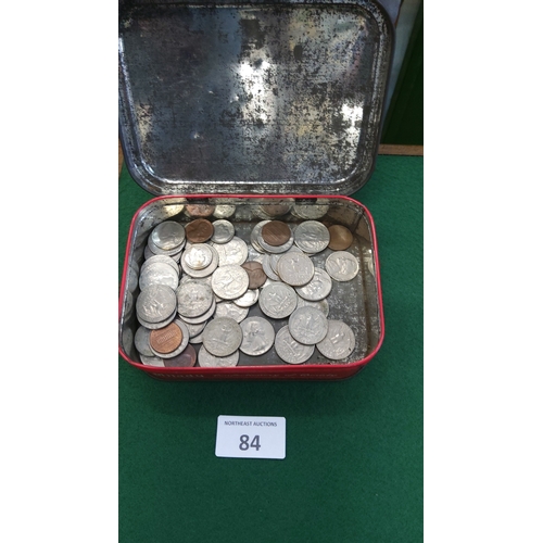 84 - Red metal tin containing assorted world base-metal coins, mid-20th century to modern, various denomi... 