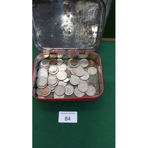 84 - Red metal tin containing assorted world base-metal coins, mid-20th century to modern, various denomi... 