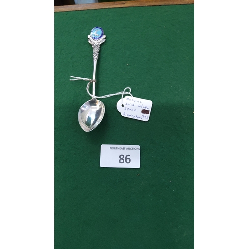 86 - Sterling silver souvenir spoon with blue enamel Masonic crest finial and Celtic-knot stem, hallmarke... 