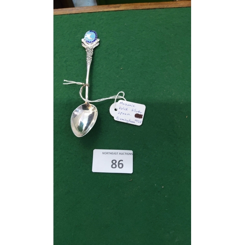 86 - Sterling silver souvenir spoon with blue enamel Masonic crest finial and Celtic-knot stem, hallmarke... 