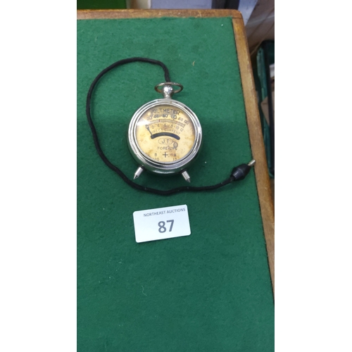 87 - Early 20th-century nickel-cased portable DC voltmeter, circular watch-form body with spike terminals... 