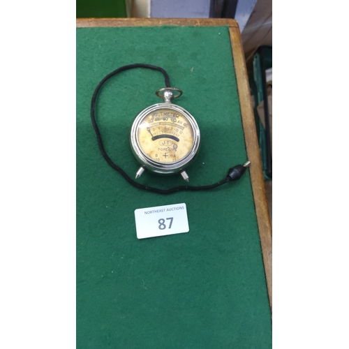87 - Early 20th-century nickel-cased portable DC voltmeter, circular watch-form body with spike terminals... 