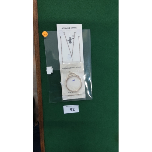 92 - Factory-sealed set comprising a sterling silver trace-link necklace and English-made sterling silver... 