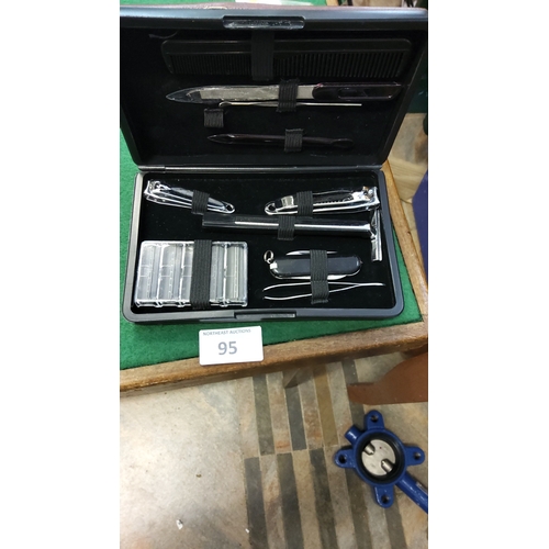 95 - Black cased gentleman’s grooming kit comprising safety razor with spare blades, pocketknife, two nai... 