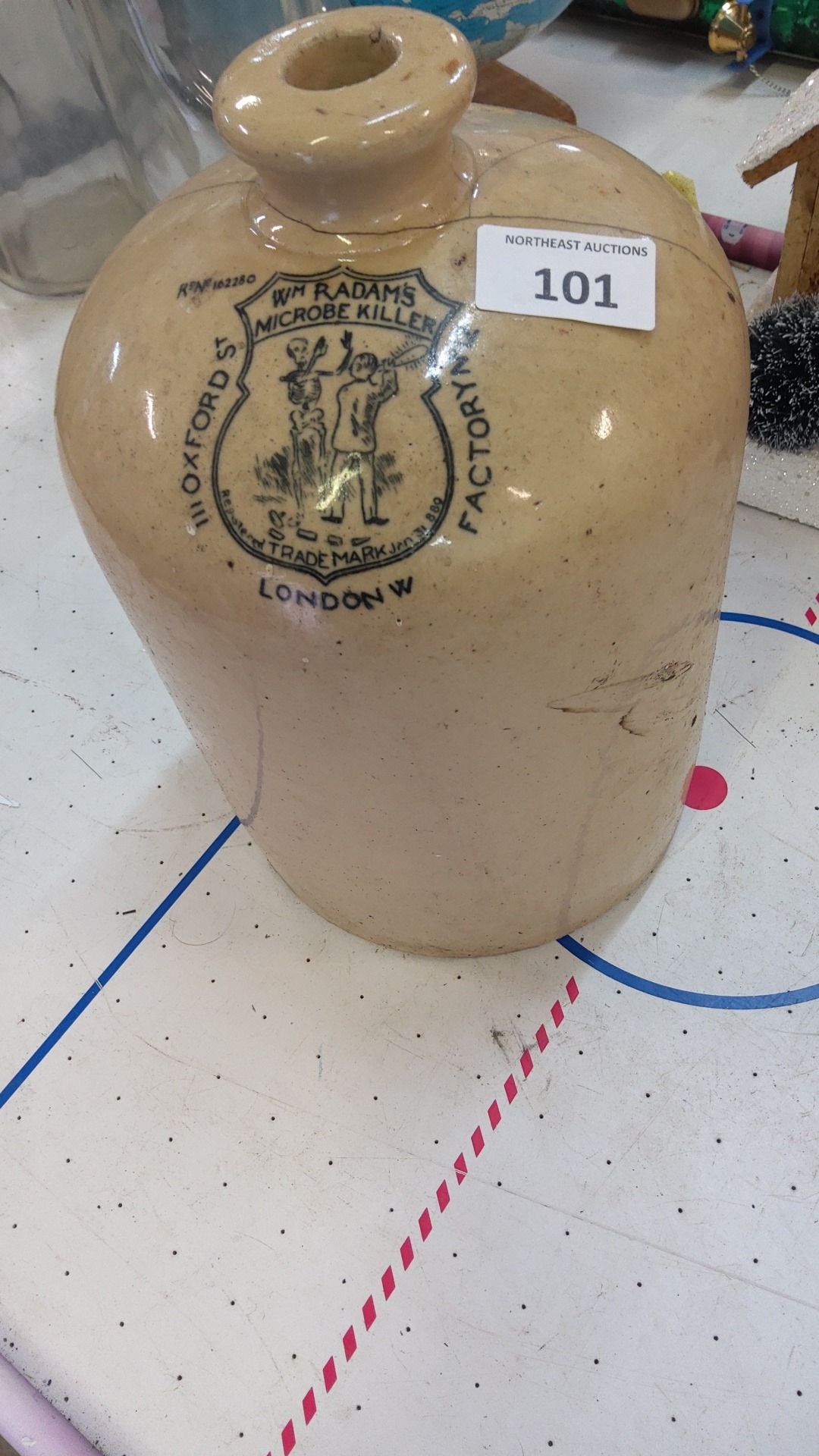 Stoneware medicinal jar with transfer-printed shield cartouche for “Wm ...