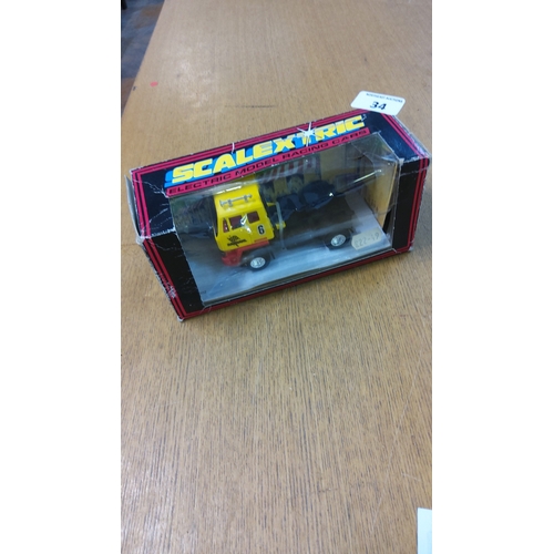 34 - Scalextric boxed yellow No.6 articulated truck slot vehicle, plastic body, with original window disp... 