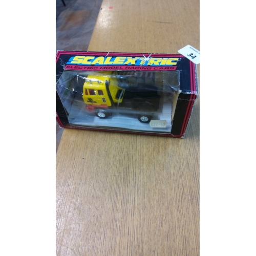 34 - Scalextric boxed yellow No.6 articulated truck slot vehicle, plastic body, with original window disp... 