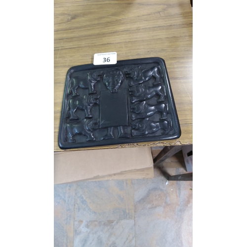 36 - Rectangular relief plaque of Irish turf depicting Daniel in the Lions' Den, after the 9th-century Mo... 