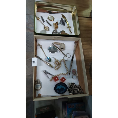 38 - Collection of assorted novelty metalware and personal accessories including miniature weapons, spoon... 
