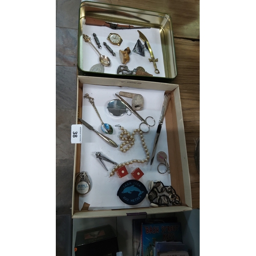 38 - Collection of assorted novelty metalware and personal accessories including miniature weapons, spoon... 