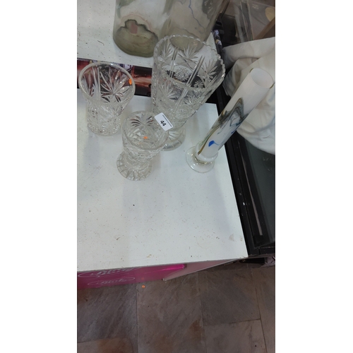 44 - Set of four assorted vases: three clear cut lead-crystal examples with hobstar and fan motifs, toget... 