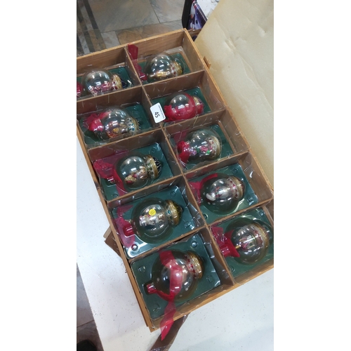 45 - Set of 10 vintage boxed glass Christmas baubles, each clear globe ornament containing hand-painted f... 